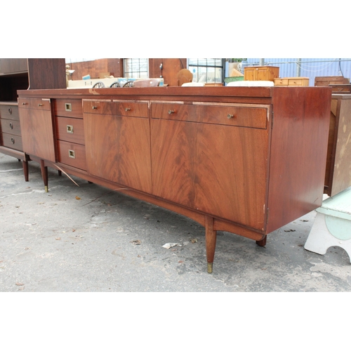 2820 - A RETRO MAHOGANY COCKTAIL SIDEBOARD ENCLOSING THREE DRAWERS, TWO CUPBOARDS AND FALL FRONT COCKTAIL S... 