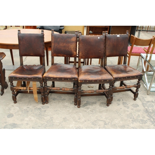 2827 - A SET OF FOUR OAK STUDDED LEATHER JACOBEAN STYLE DINING CHAIRS