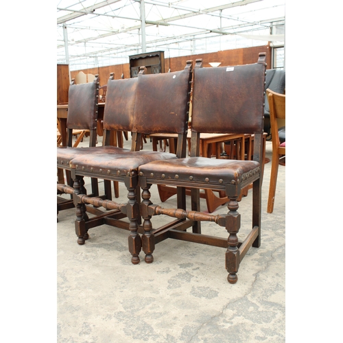 2827 - A SET OF FOUR OAK STUDDED LEATHER JACOBEAN STYLE DINING CHAIRS