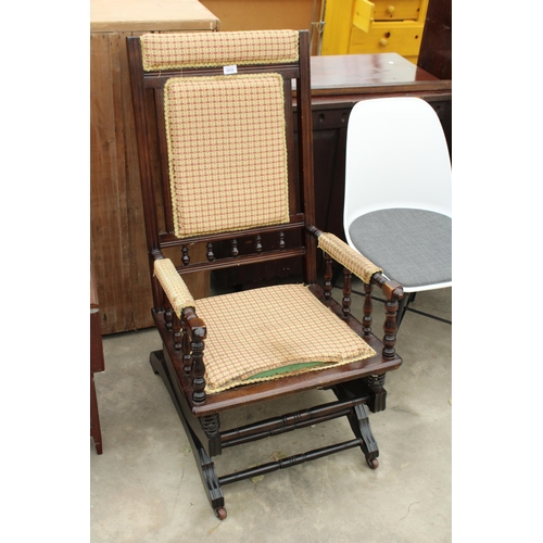 2832 - AN EDWARDIAN AMERICAN STYLE ROCKING CHAIR