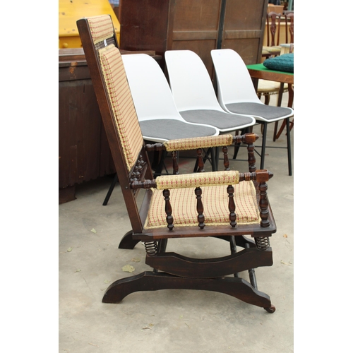 2832 - AN EDWARDIAN AMERICAN STYLE ROCKING CHAIR