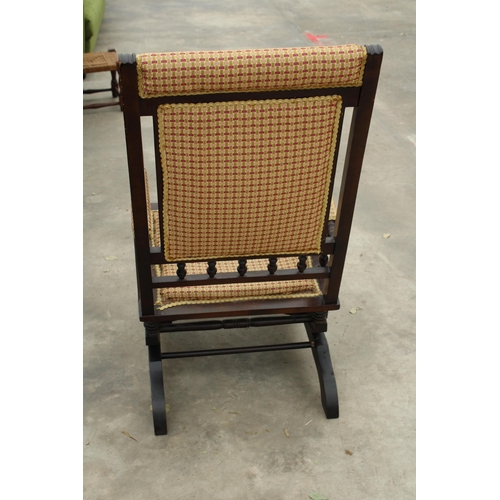 2832 - AN EDWARDIAN AMERICAN STYLE ROCKING CHAIR