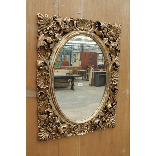 2796 - A MODERN GILT WALL MIRROR, 38