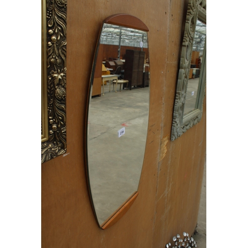 2799 - A RETRO FRAMELESS WALL MIRROR WITH TEAK TOP AND BASE, 26