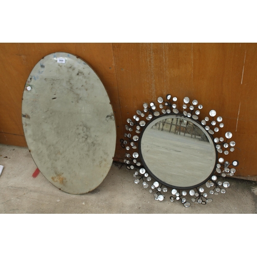 2800 - AN OVAL FRAMELESS WALL MIRROR AND 22