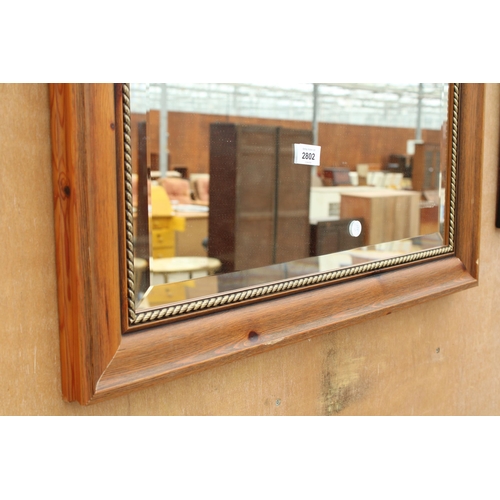 2802 - A MODERN OAKHAM BEVEL EDGE WALL MIRROR, 39