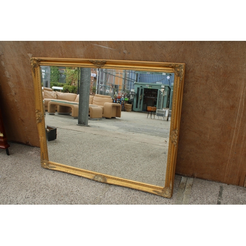 2808 - A LARGE GILT FRAMED BEVEL EDGE WALL MIRROR, 50