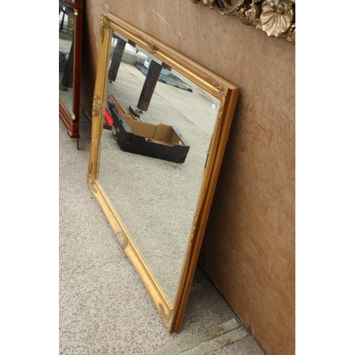 2808 - A LARGE GILT FRAMED BEVEL EDGE WALL MIRROR, 50