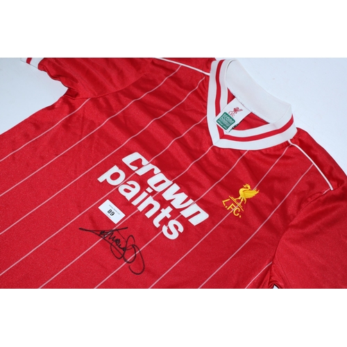 89 - A 1982 - 1988 LIVERPOOL FC FOOTBALL SHIRT SIGNED BY PAUL WALSH - WHIST WE BELIEVE THE SIGNATURE TO B... 