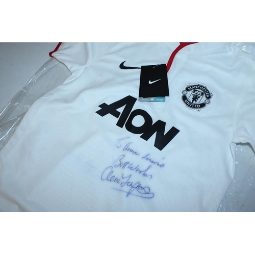 90 - A 2012 MANCHESTER UNITED FC FOOTBALL SHIRT SIGNED BY ALEX FERGUSON - WHIST WE BELIEVE THE SIGNATURE ... 