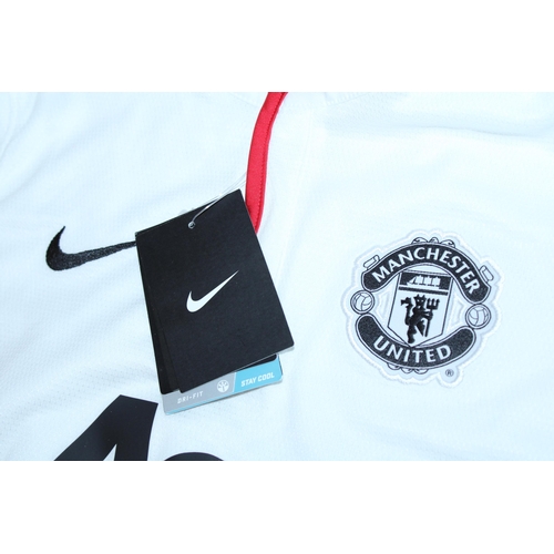 90 - A 2012 MANCHESTER UNITED FC FOOTBALL SHIRT SIGNED BY ALEX FERGUSON - WHIST WE BELIEVE THE SIGNATURE ... 