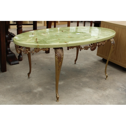 2852 - AN ONYX EFFECT OVAL COFFEE TABLE