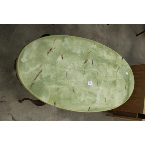 2852 - AN ONYX EFFECT OVAL COFFEE TABLE