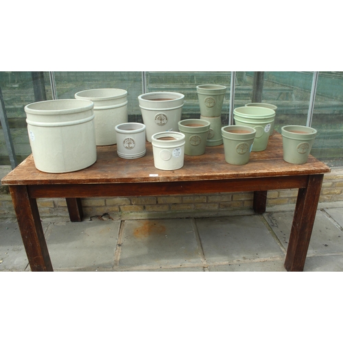 14 - TABLE AND TWELVE CREAM AND GREEN TERRACOTTA POTS PLUS VAT