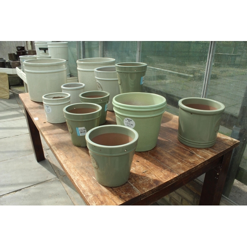 14 - TABLE AND TWELVE CREAM AND GREEN TERRACOTTA POTS PLUS VAT