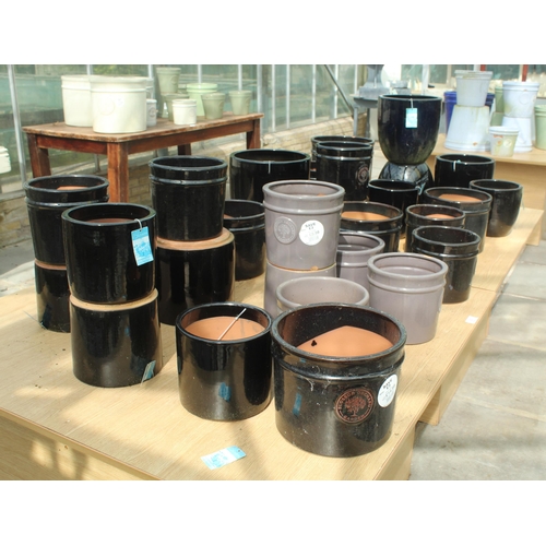 20 - TWO DISPLAY STANDS AND THIRTY BLACK AND GREY TERRACOTTA POTS  PLUS VAT