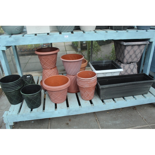 31 - DISPLAY STAND AND APPROX 54 PLASTIC POTS  PLUS VAT