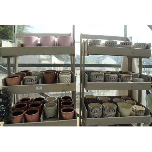 37 - TWO DISPLAY STANDS TO INCLUDE POTS BELLS AND TWO HANGING BASKETS  PLUS VAT