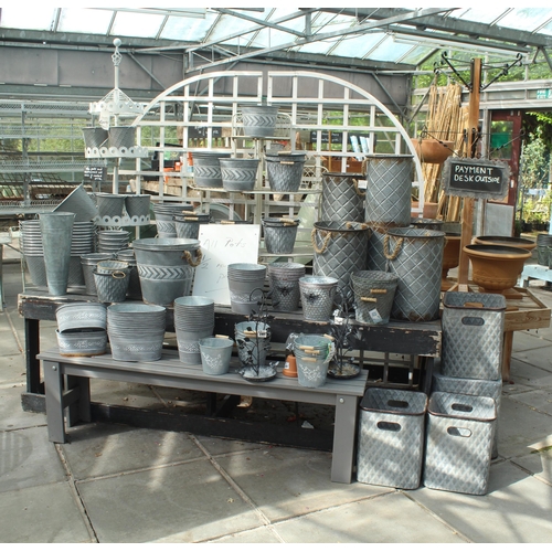 55 - TWO BENCHES/TWO DISPLAY STANDS AND APPROX 104 TIN POTS AND PLANTERS PLUS VAT