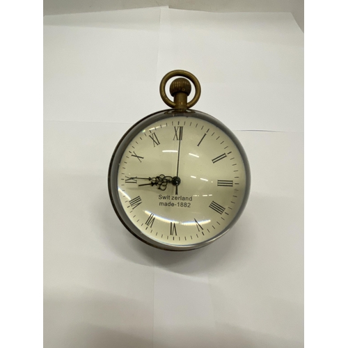 19 - A BRASS AND GLASS BUBBLE CLOCK