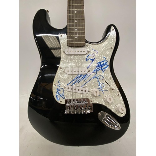 74 - A ONE DIRECTION SIGNED GUITAR SIGNED BY ALL FIVE MEMBERS OF THE BAND INCLUDING HARRY STYLES WITH CER... 