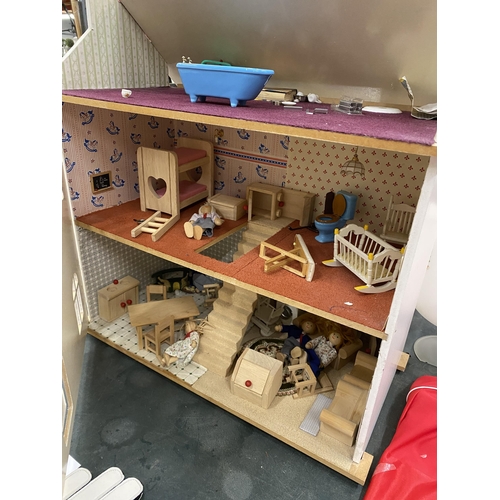 101A - A WOODEN DOLLS HOUSE WITH A QAUNTITY OF FURNITURE AND FIGURES