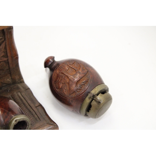 123 - HAND CARVED WOODEN PIPE RACK PLUS TWO PIPES