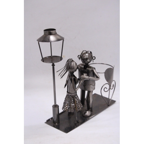 236 - A DANCING DUO METAL WINE BOTTLE HOLDER