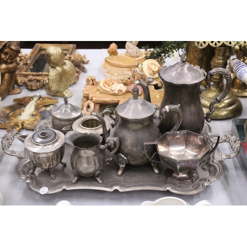 325 - A LARGE QUANTITY OF SILVERPLATE TO INCLUDE A LARGE TRAY, COFFEEPOTS, SUGAR AND MILK BOWL, ETC.,