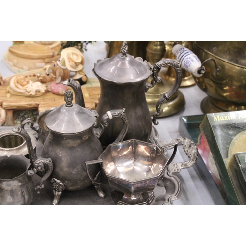 325 - A LARGE QUANTITY OF SILVERPLATE TO INCLUDE A LARGE TRAY, COFFEEPOTS, SUGAR AND MILK BOWL, ETC.,