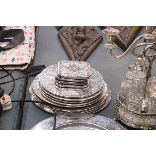 355 - A LARGE QUANTITY OF SILVER PLATED ITEMS TO INCLUDE TRAYS, CANDLEABRAS, TWO CONDIMENT SETS WITH GLASS... 