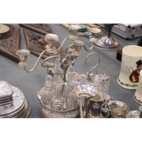 355 - A LARGE QUANTITY OF SILVER PLATED ITEMS TO INCLUDE TRAYS, CANDLEABRAS, TWO CONDIMENT SETS WITH GLASS... 