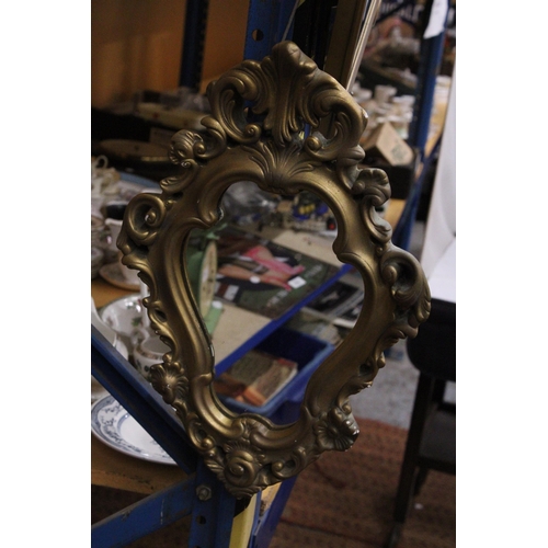 376 - AN ORNATE GILT FRAMED MIRROR