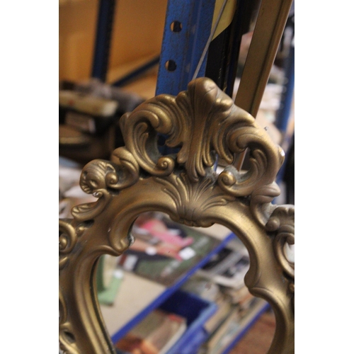 376 - AN ORNATE GILT FRAMED MIRROR