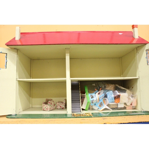 379 - A VINTAGE DOLLS HOUSE CONTAINING A LARGE QUANTITY OF FURNITURE