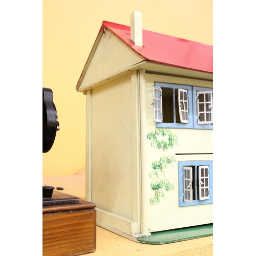 379 - A VINTAGE DOLLS HOUSE CONTAINING A LARGE QUANTITY OF FURNITURE