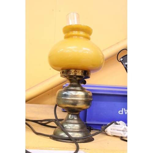 380 - A VINTAGE OIL LAMP WITH MUSTARD COLOURED GLASS SHADE