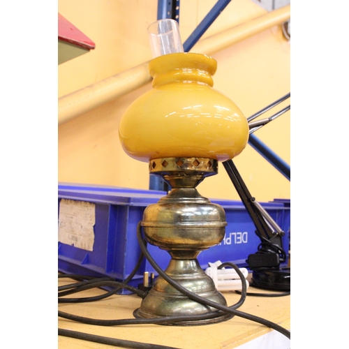 380 - A VINTAGE OIL LAMP WITH MUSTARD COLOURED GLASS SHADE