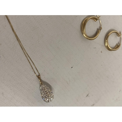 504 - THREE MARKED 9 CARAT GOLD ITEMS TO INCLUDE A PAIR OF HOOP EARRINGS AND A NECKLACE WITH CRYSTAL DROP ... 