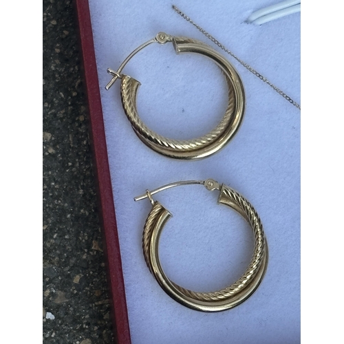 504 - THREE MARKED 9 CARAT GOLD ITEMS TO INCLUDE A PAIR OF HOOP EARRINGS AND A NECKLACE WITH CRYSTAL DROP ... 