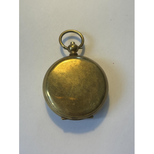 524 - A LADIES POCKET WATCH WITH A DECORATIVE WHITE ENAMEL FACE AND ROMAN NUMERALS SEEN WORKING BUT NO WAR... 