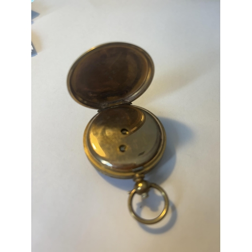 524 - A LADIES POCKET WATCH WITH A DECORATIVE WHITE ENAMEL FACE AND ROMAN NUMERALS SEEN WORKING BUT NO WAR... 