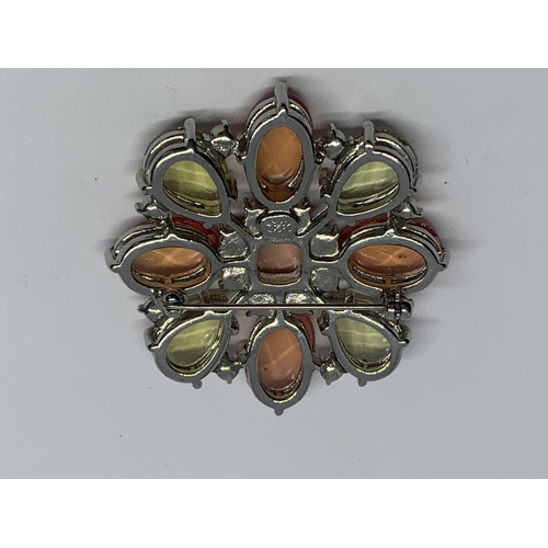 573 - A DESIGNER JOAN RIVERS BROOCH WITH PINK, ORNAGE AND GREEN STONES