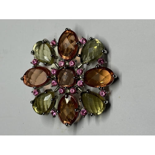 573 - A DESIGNER JOAN RIVERS BROOCH WITH PINK, ORNAGE AND GREEN STONES