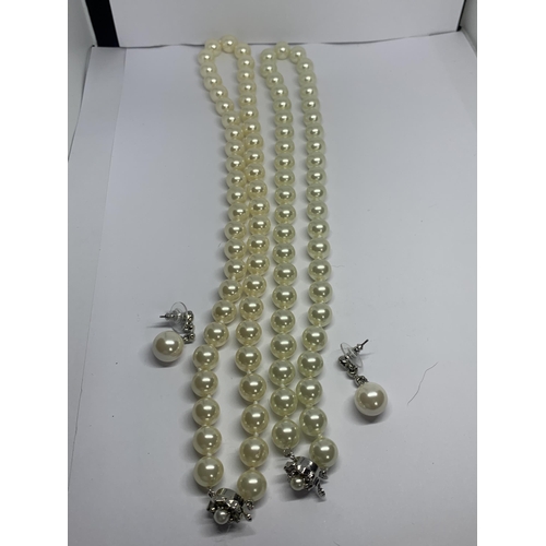 589 - TWO STRINGS OF LARGE PEARLS AND A PAIR OF MATCHING PEARL AND CLEAR STONE DROP EARRINGS