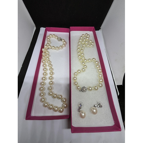 589 - TWO STRINGS OF LARGE PEARLS AND A PAIR OF MATCHING PEARL AND CLEAR STONE DROP EARRINGS