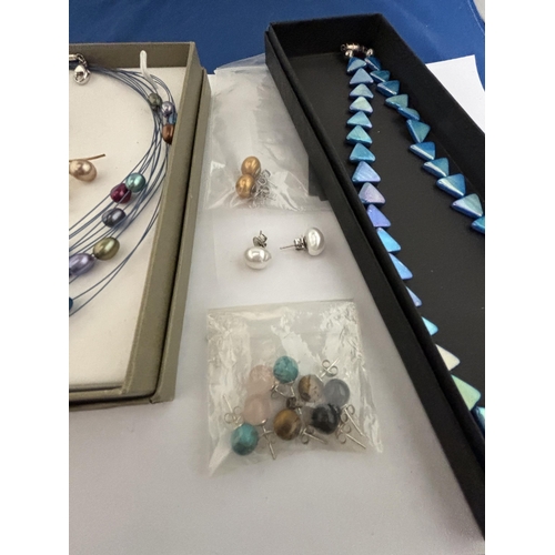 603 - A COLOURED STONE NECKLACE, NINE PAIRS OF COLOURED STONE EARRINGS AND A FURTHER BLUE NECKLACE