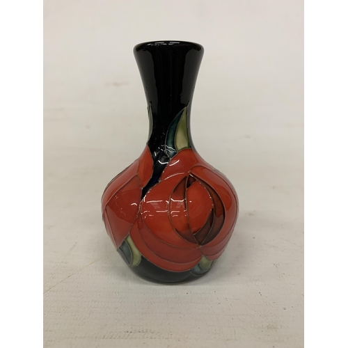 710 - A MOORCROFT 4 INCH RED ROSE VASE