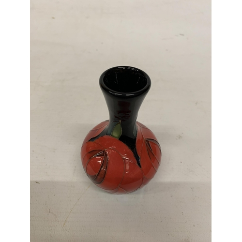 710 - A MOORCROFT 4 INCH RED ROSE VASE