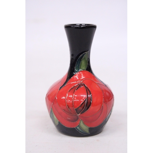 710 - A MOORCROFT 4 INCH RED ROSE VASE